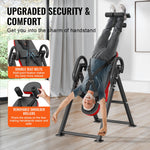 Foldable inversion table for strength training featuring upgraded security and comfort with double seat belts and removable shoulder rollers.