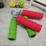 hand strength training equipment with colorful foam grips in red and green for exercise and rehabilitation training.
