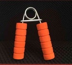 Hand strength training equipment with orange foam grips for effective hand rehabilitation and exercise.